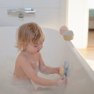 Mushie siurbtukinis suktukas (Suction Spinner Toy) – Sunshine