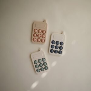Mushie telefono spaudimo žaislas (Pop it) – Tradewinds